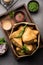 SamosaÂ Snack is an Indian deep fried pastry with a spiced filling usually made with potatoes, spices and herb